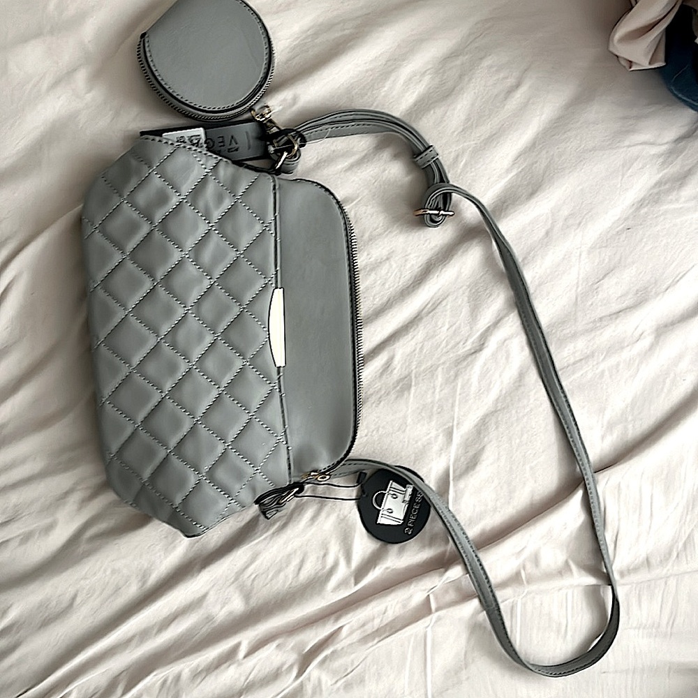 Never been used 2 piece set vegan approved purse in the color lemor grey